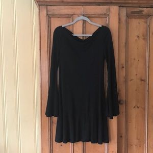 Sexy black dress ! Open back with bell sleeves .